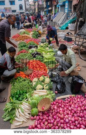 Kolkata, West Bengal, India - 16th December 2018 : Roadside Market For Vegetables For Sale. Young Ma