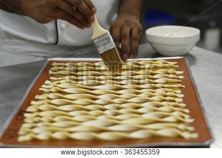 Chef Making Lavash Bread Sticks In Bakery Kitchen