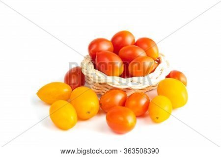 Cherry Tomatoes In A Basket. (solanum Lycopersicum Var. Cerasiforme) Isolated On White Background An