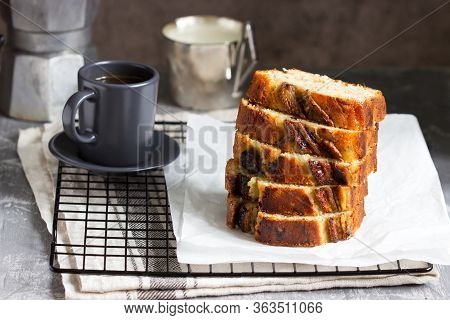 Banana Muffin With Candied Ginger And Raisins And Drinks On A Gray Background.