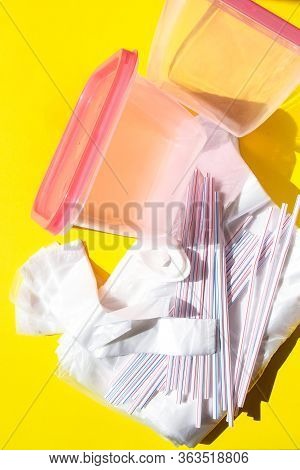 Plastic Lunch Boxes And Drinking Straws, Clear Plastic Bags On Yellow Background, Colorful Plastic C