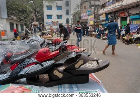 Kolkata, West Bengal, India - 16th December 2018 : Shoes Are Put Up On Roadside Wheel Cart For Sale.