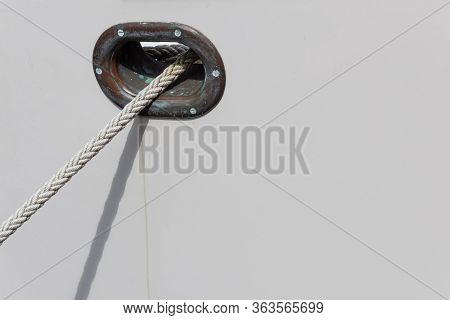 Patina On Metal Hawsehole In A White Boat Hull With White Rope, Clean Marine Copy Space, Horizontal 