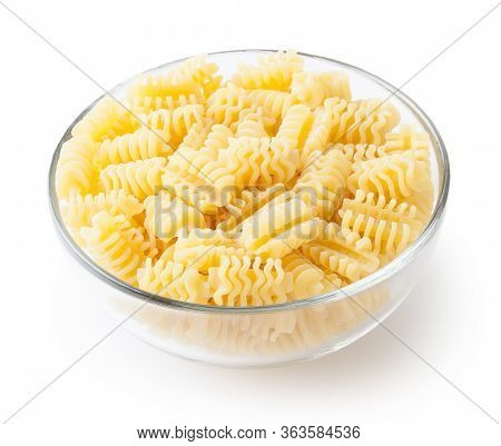 Uncooked Radiatori Pasta In Glass Bowl Isolated On White Background With Clipping Path