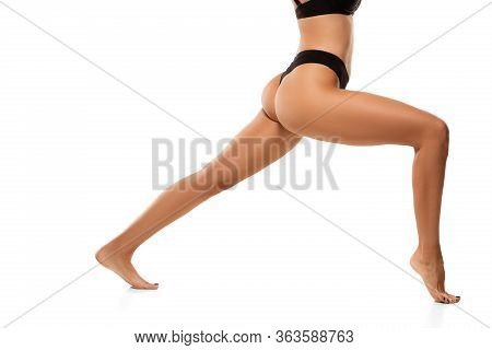 Beautiful Female Legs, Buttlocks And Belly Isolated On White Background. Beauty, Cosmetics, Spa, Dep