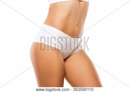 Beautiful Female Legs, Buttlocks And Belly Isolated On White Background. Beauty, Cosmetics, Spa, Dep