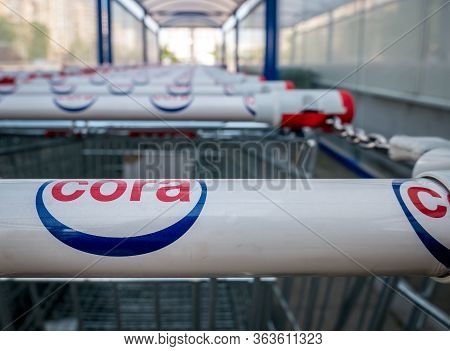 Bucharest/romania - 04.27.2020: Shopping Carts Belonging To Cora Hypermarket. Logo Of The French Ret