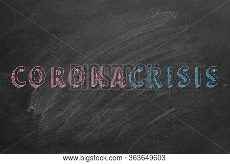 Text Coronacrisis Are Drawn With Chalk On A Blackboard.