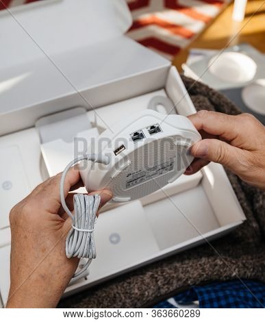 Paris, France - Circa 2020: Senior Hands Unboxing Unpacking New Parcel From Amazon Prime Containing 