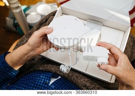 Paris, France - Circa 2020: Senior Hands Unboxing Unpacking New Parcel From Amazon Prime Containing 