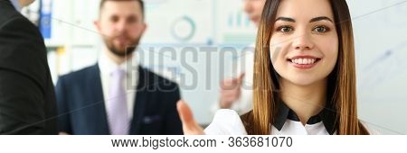 Portrait Of Pretty Lady Reaching Tender Arm To Perform Friendly Gesture Towards Colleague Or Busines
