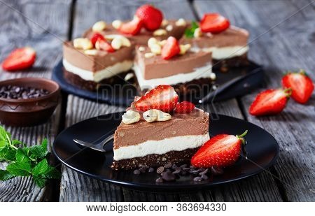 Gluten-free Chocolate Tart Of Two Chocolate Layers Made Of Coconut Cream Soaked Cashews With White A