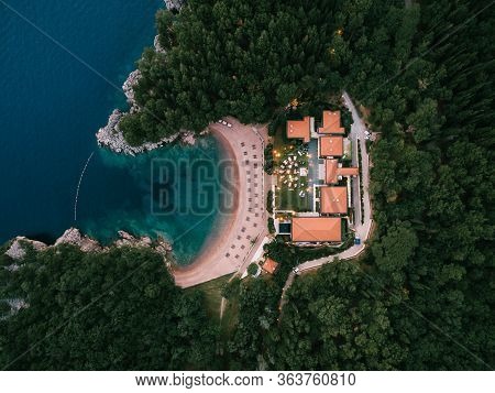 Budva, Montenegro - 10 June 2019: Wedding Banquet, Dinner, At Dusk Under The Light Of Garlands. Tabl
