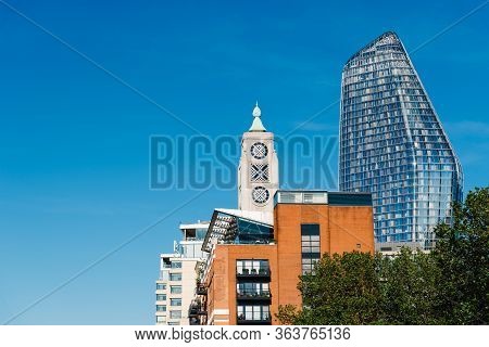 London, Uk - May 14, 2019: Low Angle View Of Oxo Tower And Modern One Blackfriars Tower Against Blue