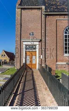 Heeg, Netherlands - March 22, 2020: Path Leading To The Entrance Of The Historic Church Of Heeg, Net