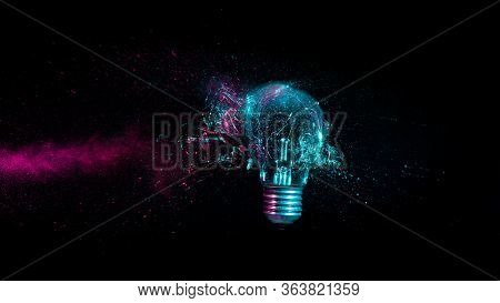 explosion of a traditional electric bulb. shot taken in high speed, at the exact moment of impact. concept of creativity and fragility.