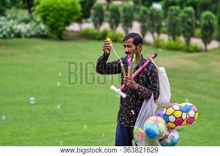 Delhi / India - September 22, 2019: Man Selling Toys In Lodhi Gardens In New Delhi, India