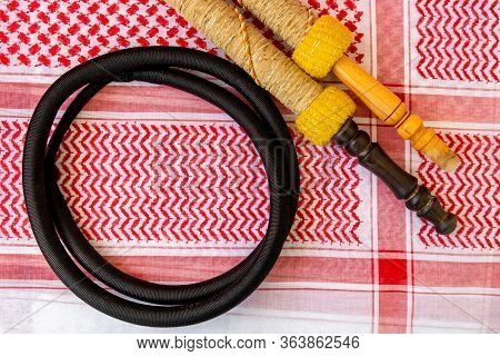 Traditional Arab Male Clothes - Kaffiyah, Igal, And Hookah Craft Wooden Accessories Close-up.