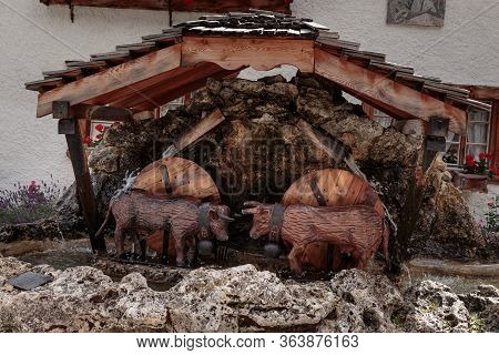 Grimentz, Valais, Switzerland - August 9 2018 : Sculpture - Fountain Of Fighting Cows Called Combat 