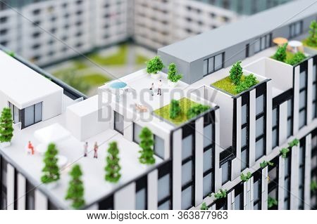 Miniature Model, Miniature Toy Buildings, Cars And People. City Maquette. New Building Project