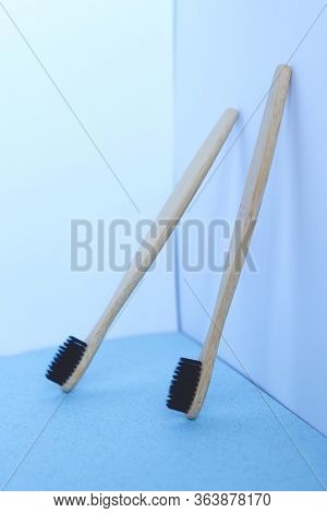 Zero Waste Concept. Bamboo Toothbrushes On A White-blue Background