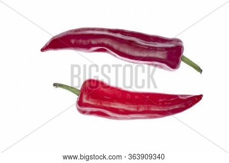 Two Red Ramiro Peppers Isolated On White. Space For Text