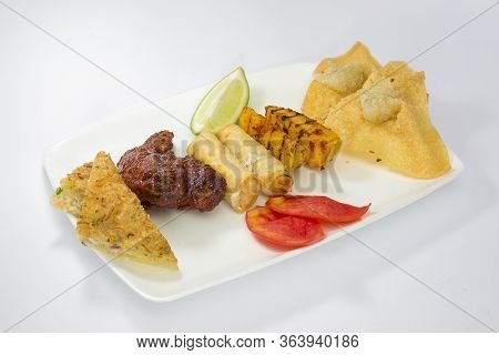 Auonthon, Spring Roll, Prawn Toast, Grilled Potato And Buffalo Wings Platter.