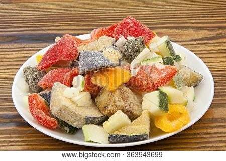 Frozen Vegetables Gorse Or Tomatoes Corn Peas Bell Peppers Carrots On A Plate