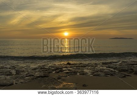 Brautiful Golden Sunrise Scene With Hatta Island On The Horizon Far Away Seen From Campsite Besar Is