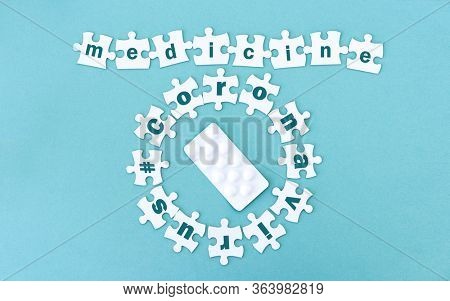 Medecine and coronavirus row and circle around pills made from white puzzle pieces