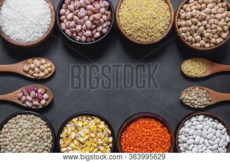 Different Type Of Raw Dry Legumes Composition. White Beans, Lentils, Bulgur, Chickpeas, Kidney Beans