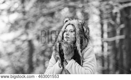 Girl In Snowy Forest. Faux Fur Animal Hat Perfect For Fantasy Theme. Heartwarming Concept. Animal Ca