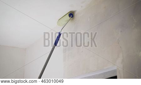 The Process Of Applying A Primer To A Wall Using A Roller. The Primer Solution Is Applied To The Wal