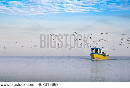 Homecoming: Tired Fishermans Ship Approaching After A Hard Day. Rewal, Baltic Sea, Poland