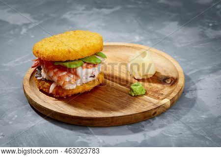 Pan-asian Cuisine Concept. Japanese Sushi Burger Made From Rice Bread, Crab Meat, Avokado And Wasabi