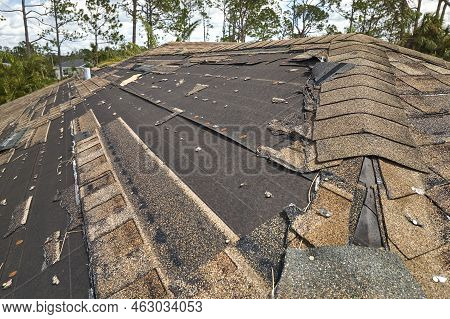 Hurricane Ian Destroyed House Roof In Florida Residential Area. Natural Disaster And Its Consequence