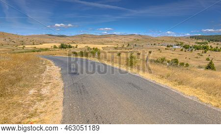 Sunrise Over Road In Highland Limestone Karst Plateau Landscape On Causse De Mejean, Occitanie, Fran
