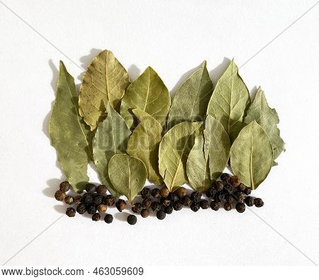 Texture, Background. Dry Bay Leaf And Peppercorns On A White Background, Seasoning.