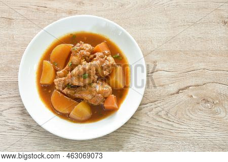 Boiled Chicken Leg With Potato In Swet Red Gravy Sauce Stew On Plate