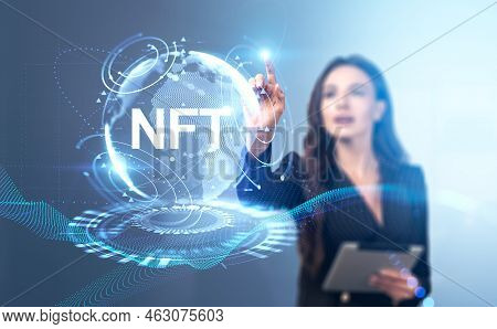 Businesswoman With Tablet Finger Touch Nft Hologram With Glowing Earth Globe, Metaverse. Non Fungibl