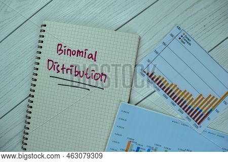 Concept Of Binomial Distribution Write On A Book Isolated On Wooden Table.