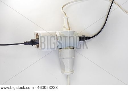 White Adapter With Included Wires On A Light Background, Horizontal