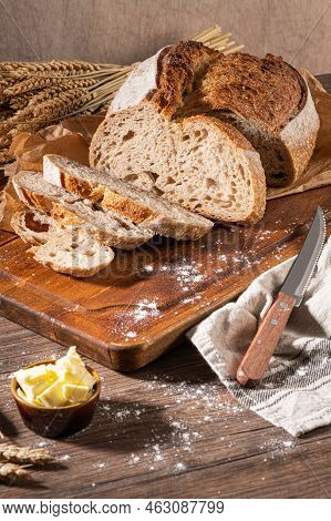 Freshly Artisan Baked Wheat And Rye Bread, Country Bread. Simple Bread  With Butter For Breackfast
