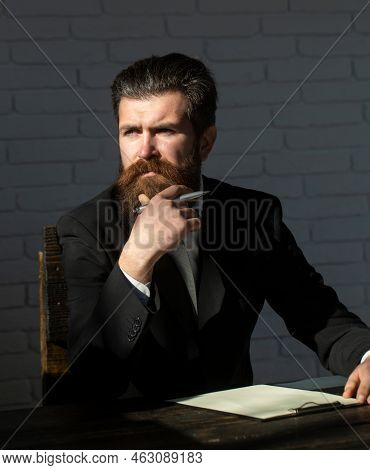 Portrait Of A Teacher Or Professor At Classroom. Satisfied Serious Mature Teacher. Mature Professor,
