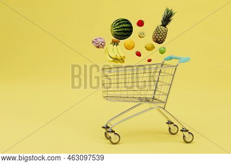 Buying Fruit In The Supermarket. A Trolley For Products Over Which There Is A Lot Of Fruit. Copy Pas