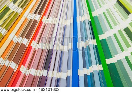 Color Guide Close Up. Assortment Of Colors For Design. Colors Palette Fan On White Concrete Wall Bac