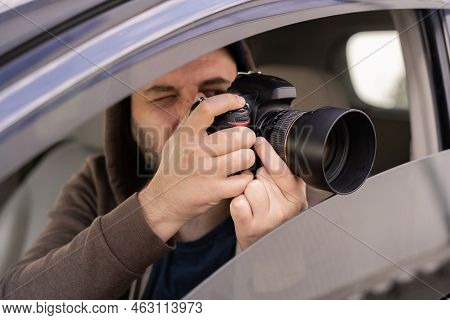 Male Driver Photographing With Slr Camera From Car, Private Detective Taking Photos