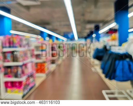 Abstract Blur Empty Supermarket Discount Store Aisle And Product Shelves Interior Defocused Backgrou