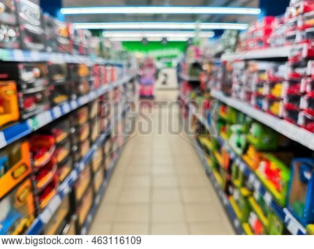 Abstract Blur Empty Supermarket Discount Store Aisle And Product Shelves Interior Defocused Backgrou