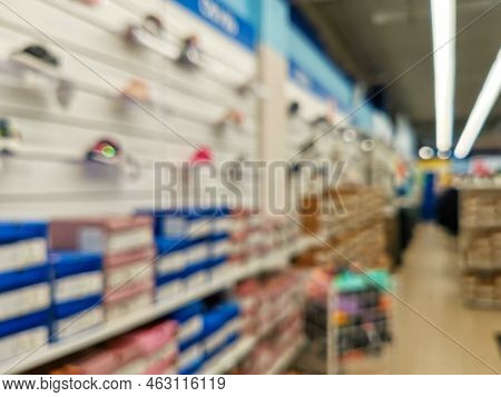 Abstract Blur Empty Supermarket Discount Store Aisle And Product Shelves Interior Defocused Backgrou